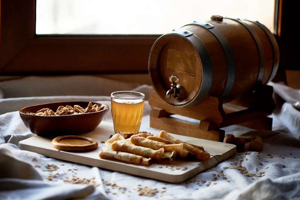 Mead with food served from a wooden cask.